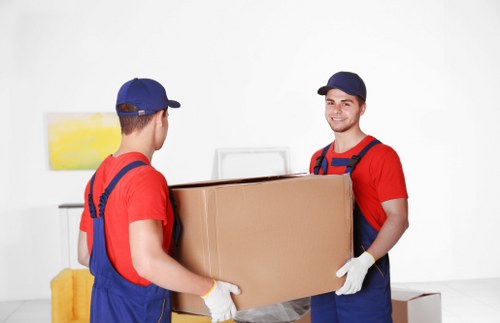 Professional man and van team handling a flat move in Willesden