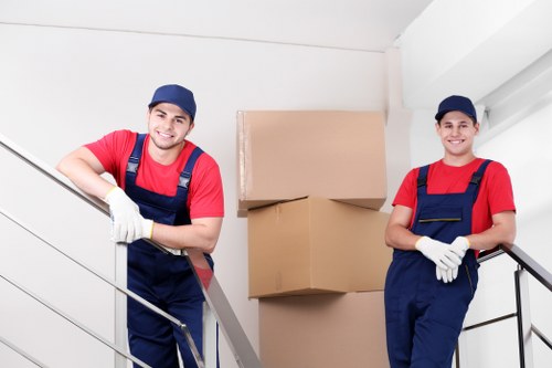 Professional movers packing boxes during a Willesden relocation