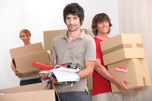 Warehouse staff handling items safely with protective gear