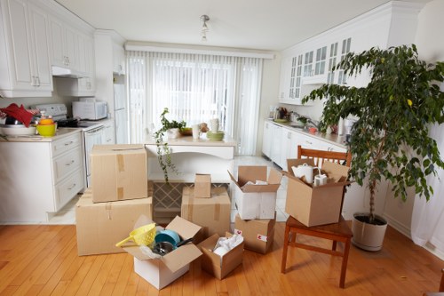 Carefully loaded furniture and packed boxes inside a small moving van