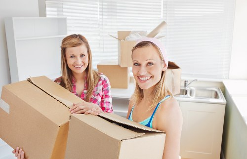 Local removals team handling furniture during a Willesden relocation