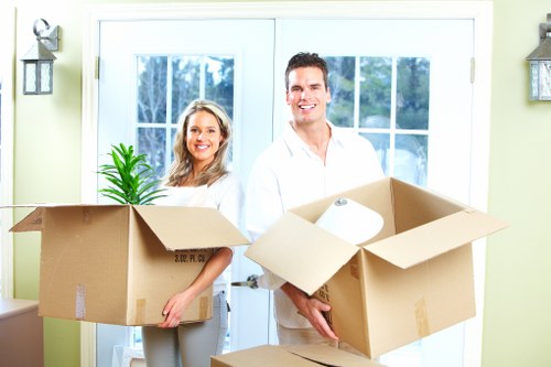 Packed storage unit in Willesden with labeled boxes and furniture